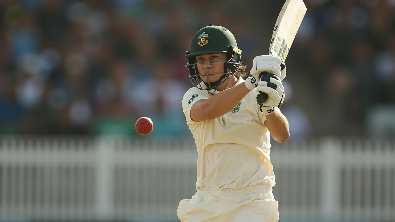 A women's T20 all-rounder in batting follow-through during a Hundred-style fixture
